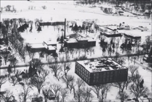 Aerial of campus 1955 - barns in back far right